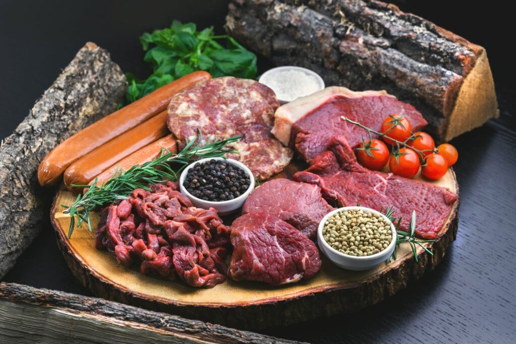 A plate with different kinds of meat ready to get cooked.