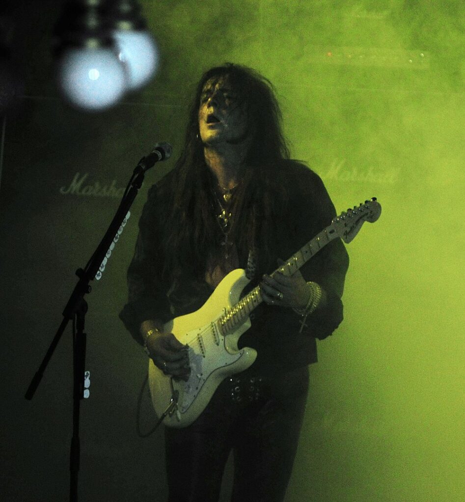 Yngwie Malmsteen playing with his legendary virtuosity