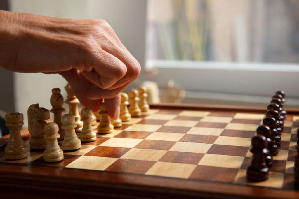 a chessboard with all its pieces and a player ready to match